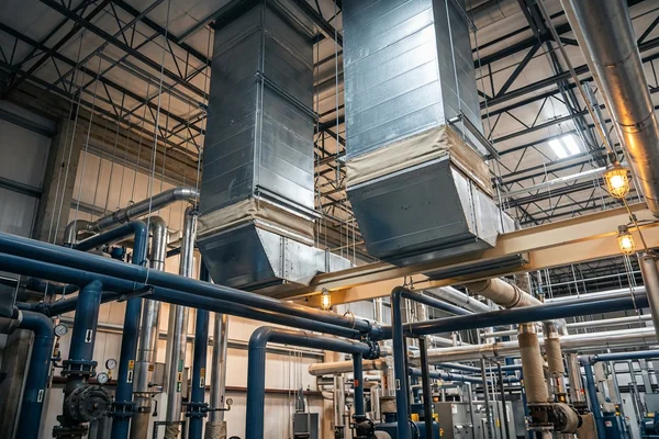 Duct drops under a 20-ton RTU inside a warehouse