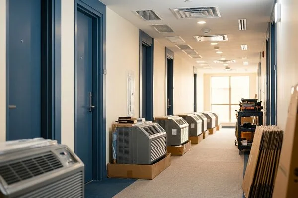 New PTAC units staged for a floor-by-floor suite program
